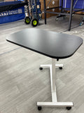 Umpires table adjustable height and versatile