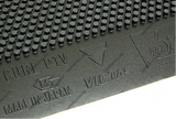 Close-up of a black Victas Curl P1V rubber mat with a raised textured pattern, showing embossed branding and 'MADE IN JAPAN' text.