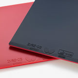 Two butterfly table tennis boards, one red and one black, on a white background.