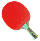 Close-up of a red ping pong paddle with a blurred sports arena background
