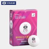 YINHE H40+ table tennis balls with seam packaging and one loose white ball in front, on a light gray background.