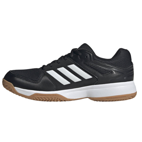 Black Adidas shoe with white stripes on a white background